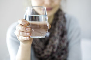 Young woman drinking water